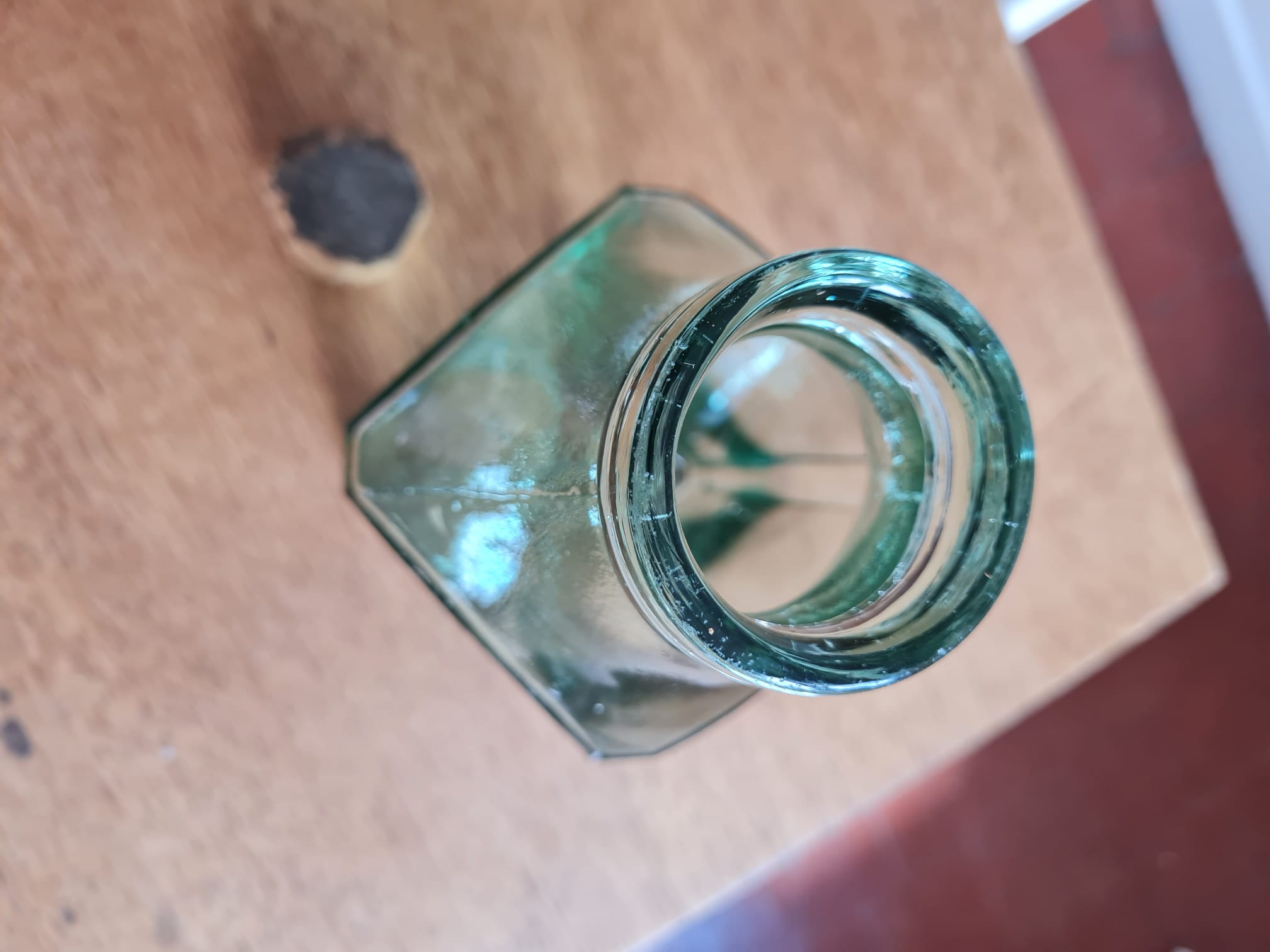 Green blown glass bottle