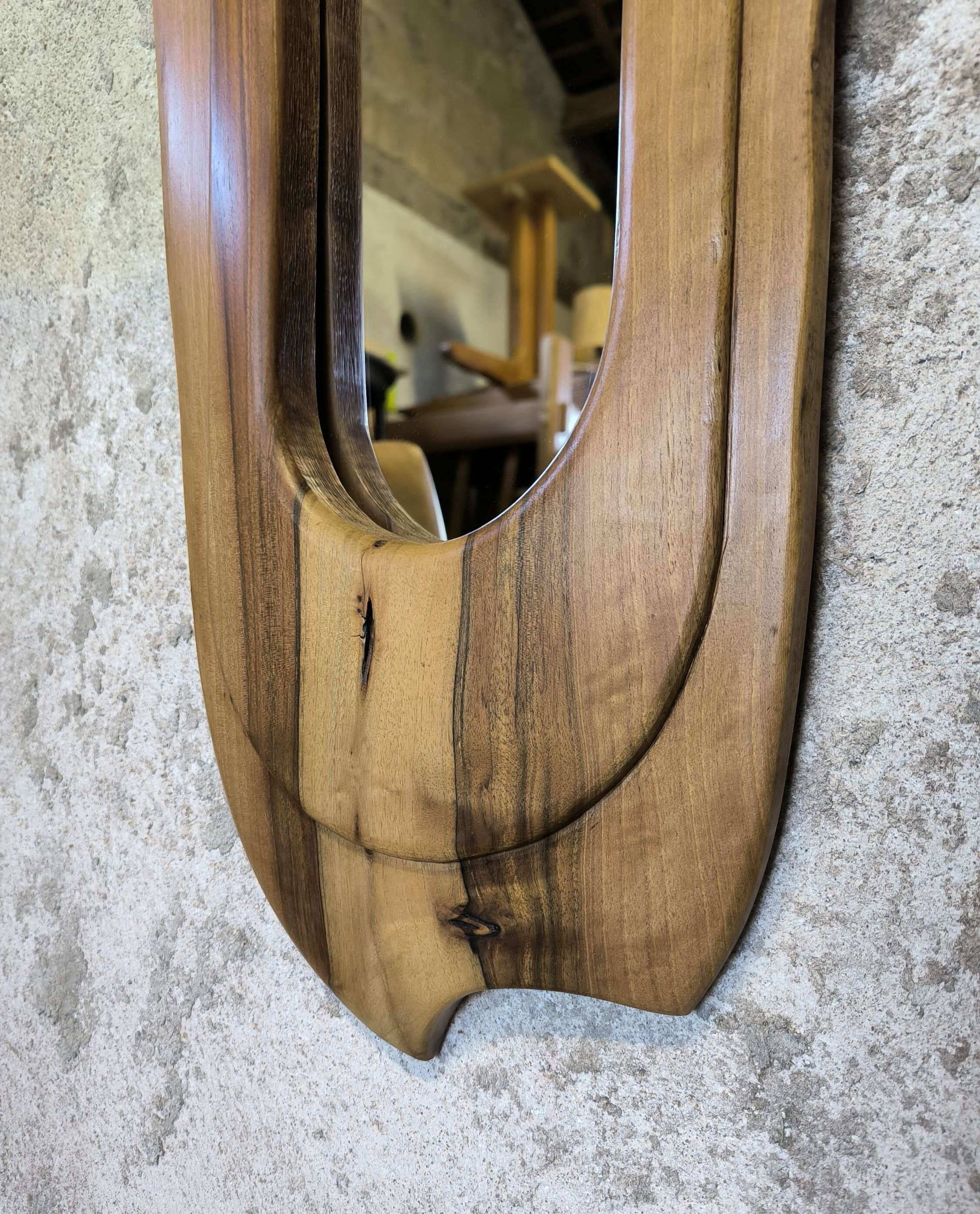 Vintage free-form mirror in solid wood.