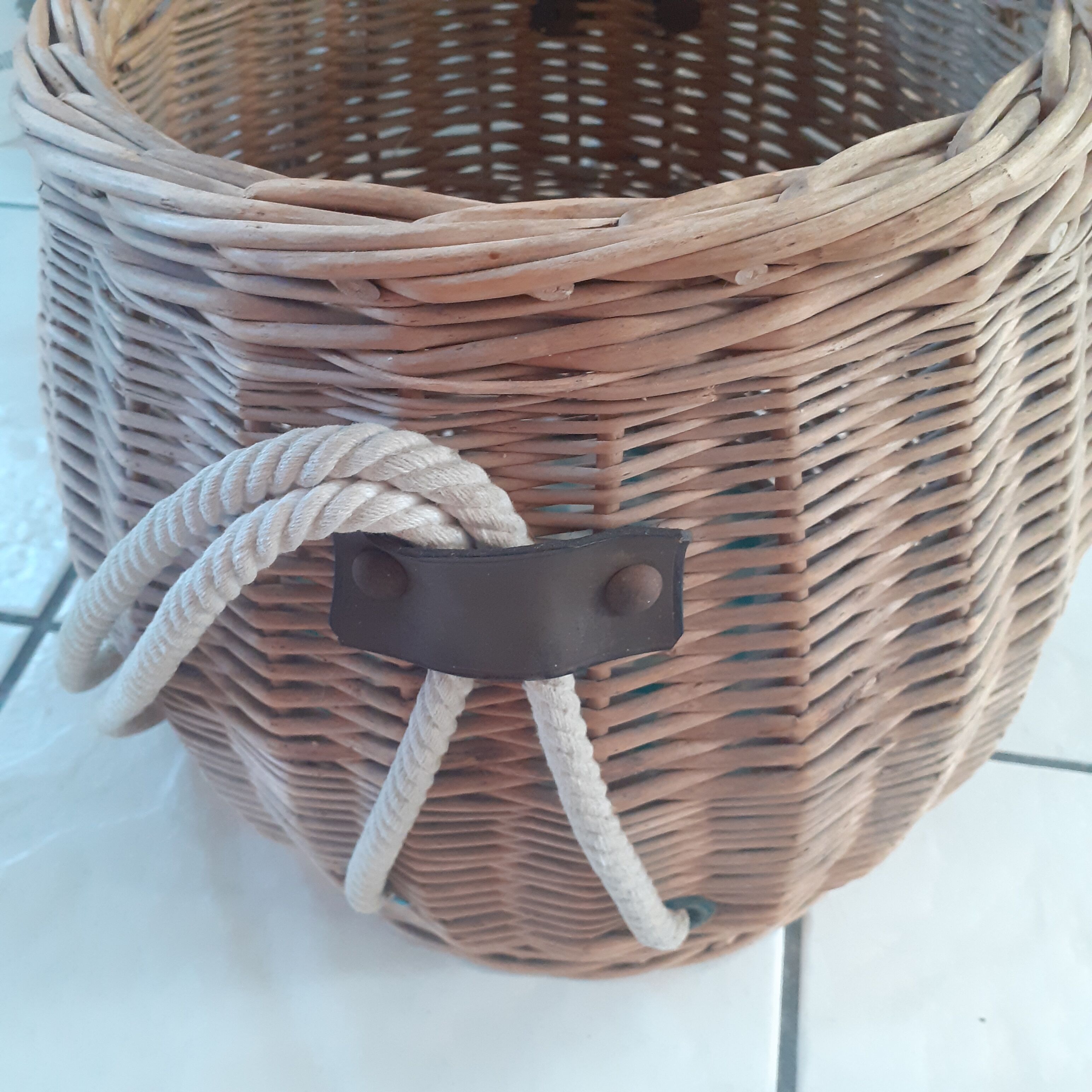 Old rattan basket. round with 2 rope handles.