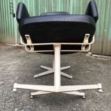 Pair of vintage armchairs in black skai with metal legs.