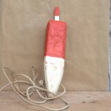 Old red and white wooden buoy