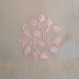 Old embroidered tablecloth in light green color