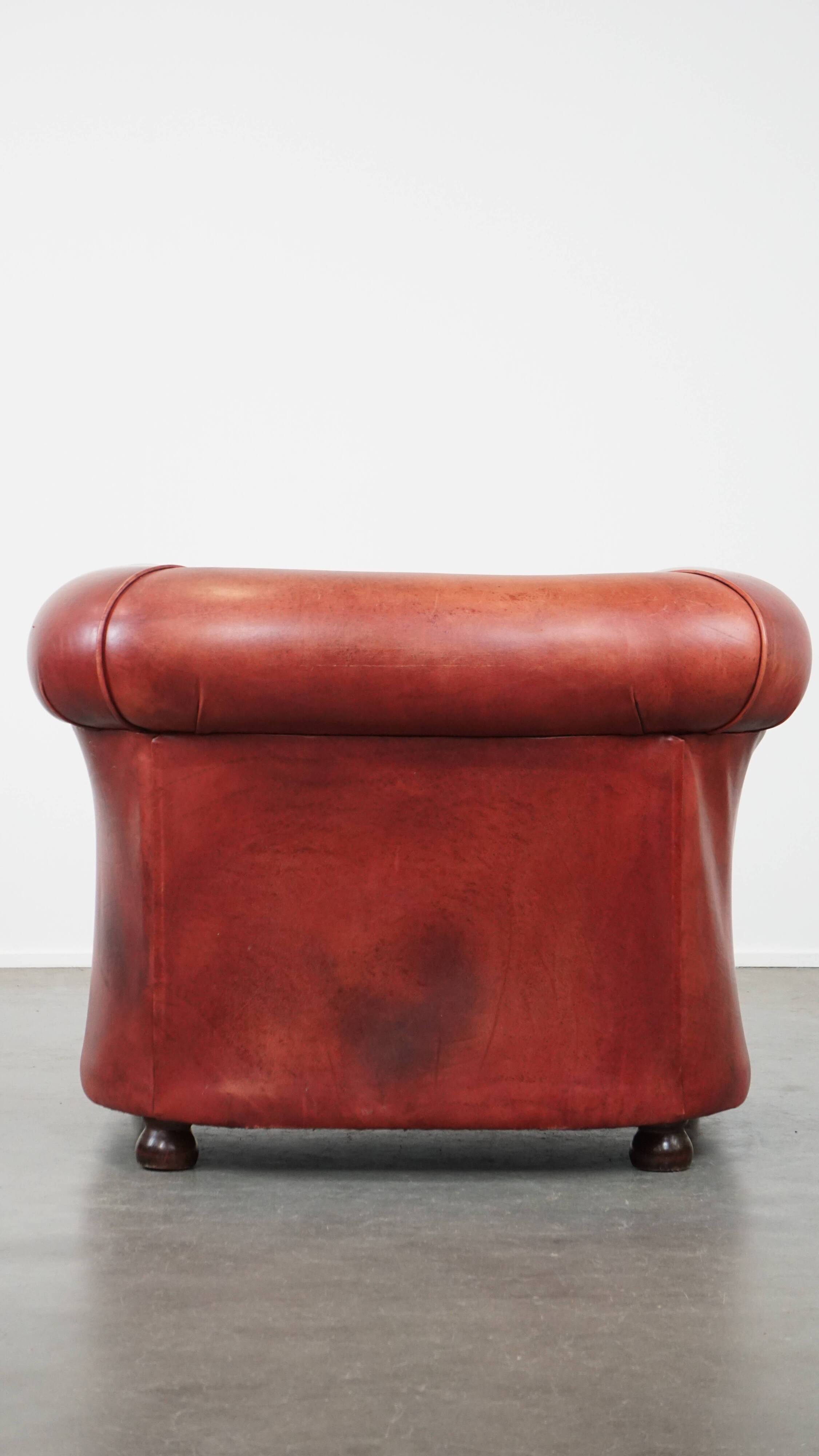 English Chesterfield club chair in light red cowhide leather