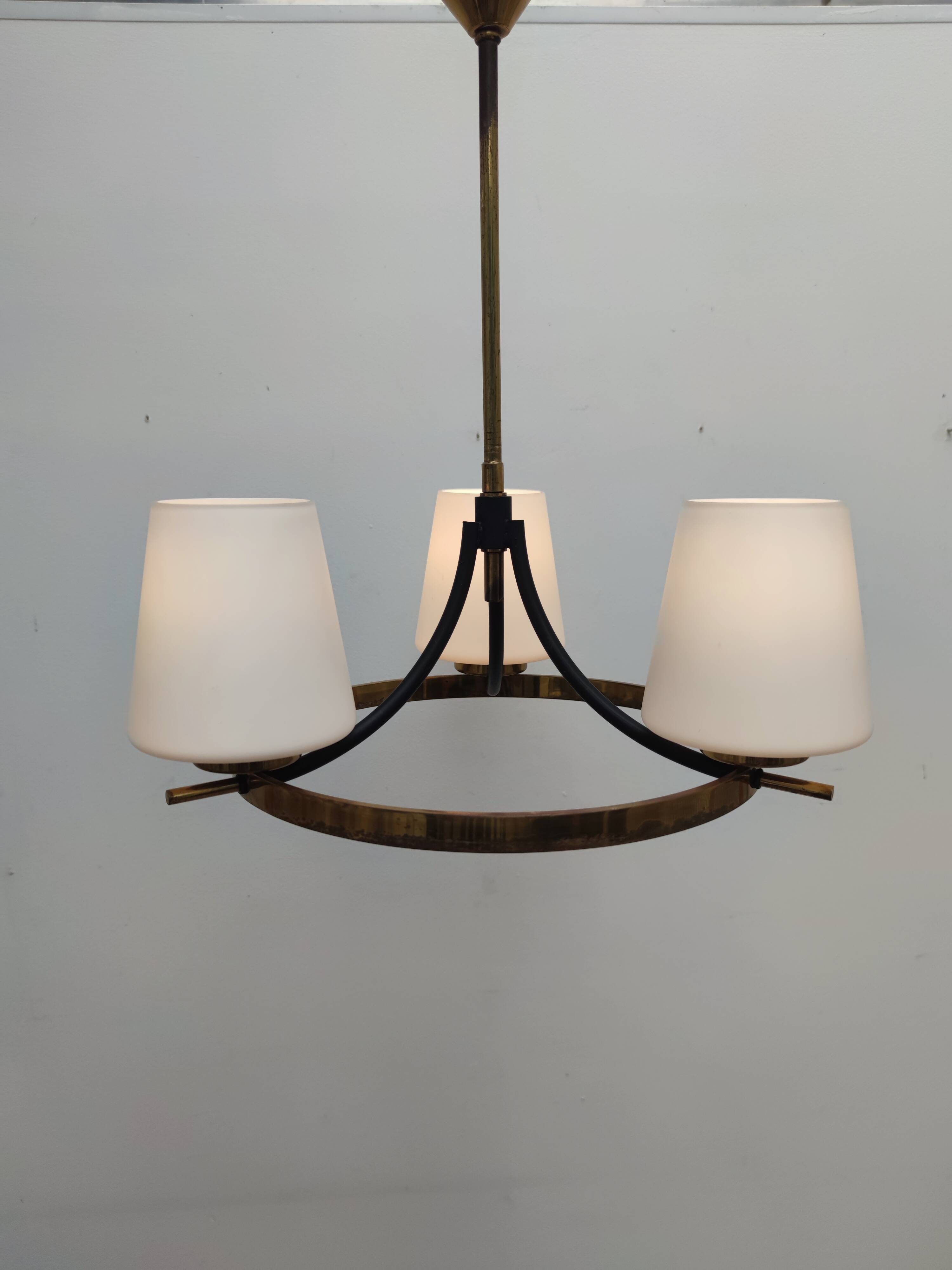 Brass chandelier and white opalines