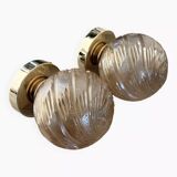 Pair of golden globe wall lights