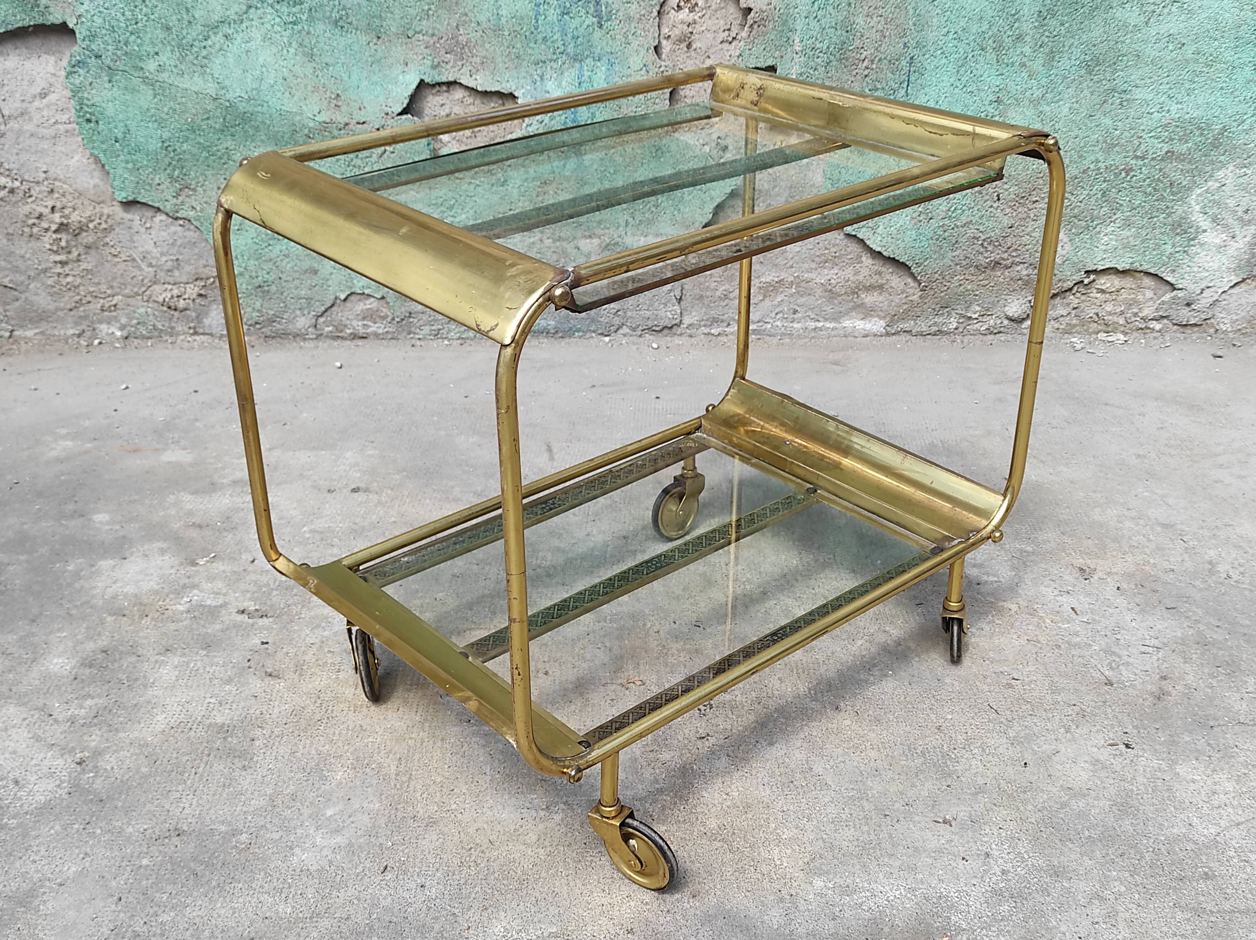 Old rolling coffee table serving vintage brass bar 50s mid-century design