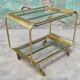 Old rolling coffee table serving vintage brass bar 50s mid-century design