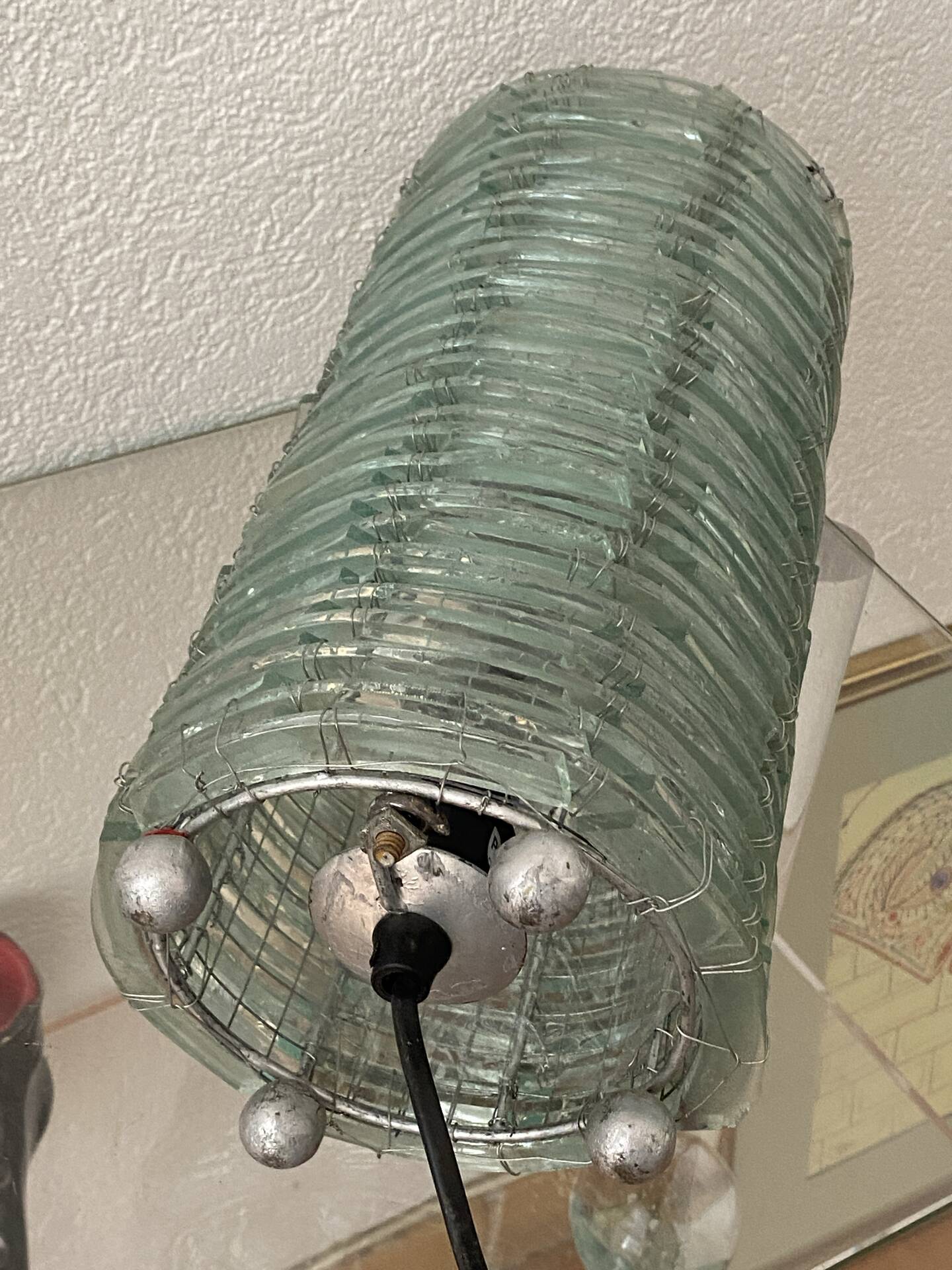 Blue-tinted glass lamp and wire.