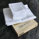 White damask table service consisting of a large tablecloth and 12 napkins