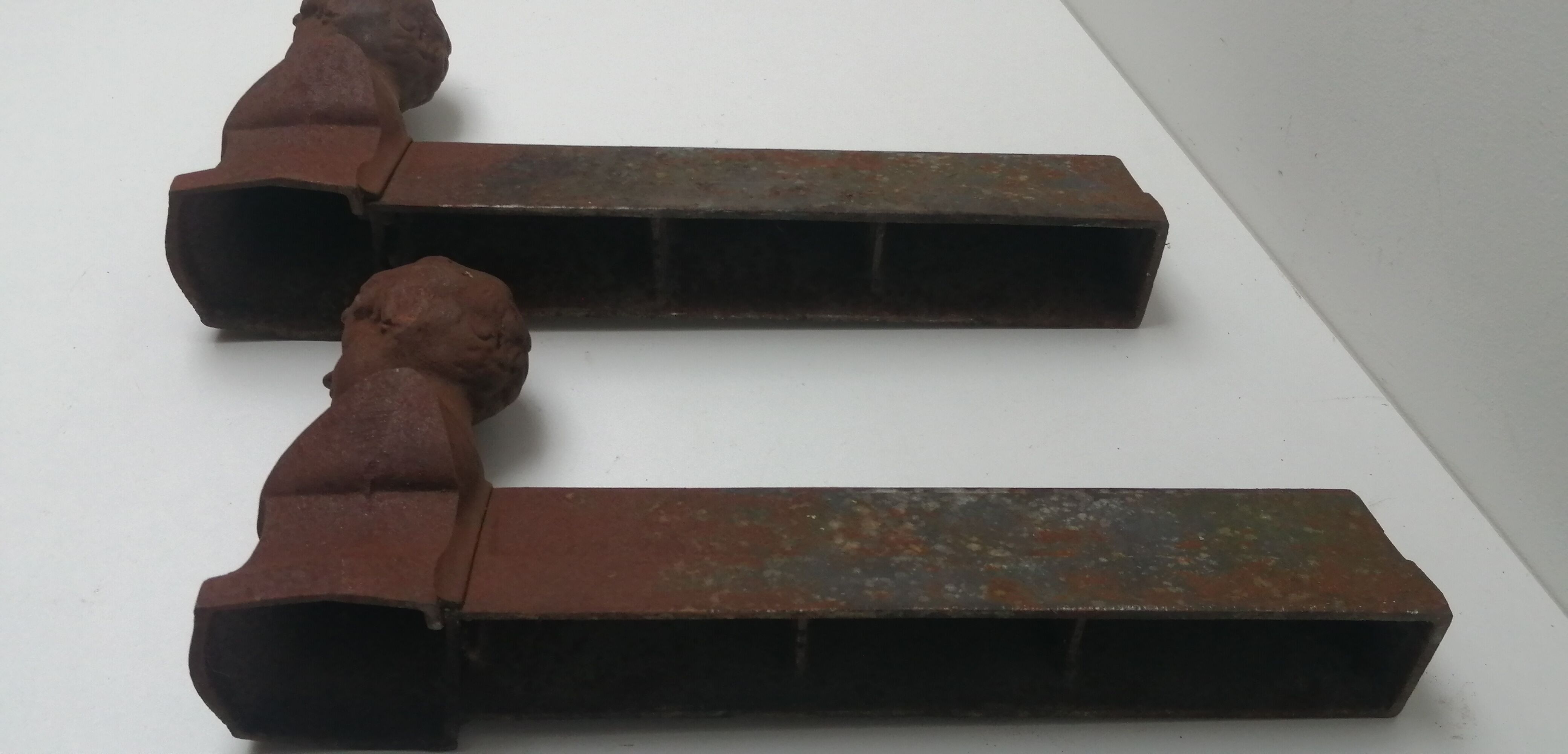 Pair of cast iron fireplace chenets "children"