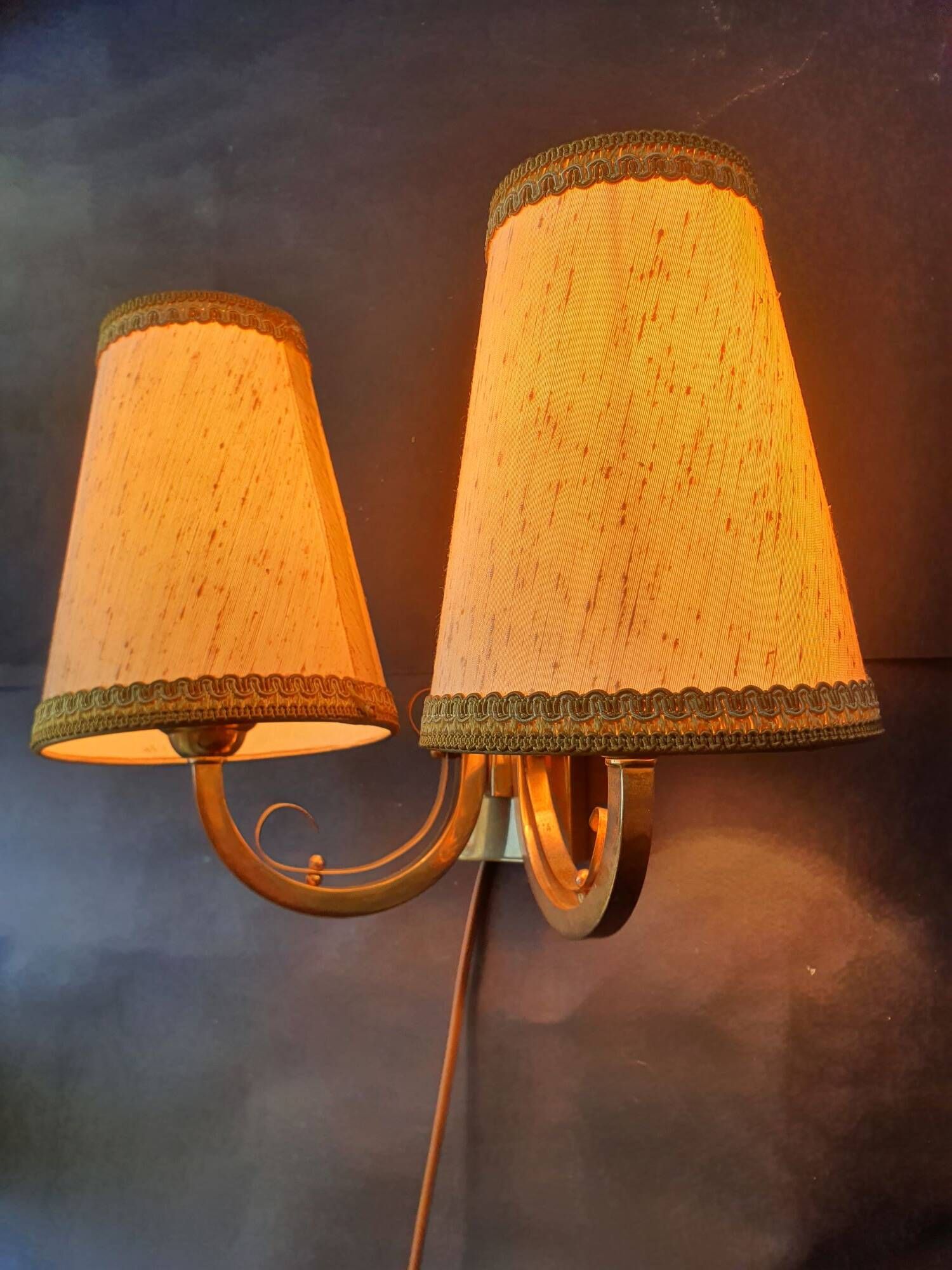 Pair of bronze wall sconces with 1940s Art Deco lampshades.