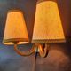 Pair of bronze wall sconces with 1940s Art Deco lampshades.