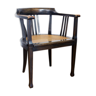 Old chair made of solid wood and caning