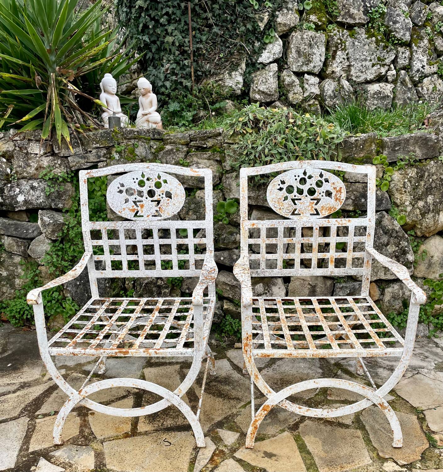 Pair of wrought iron armchairs