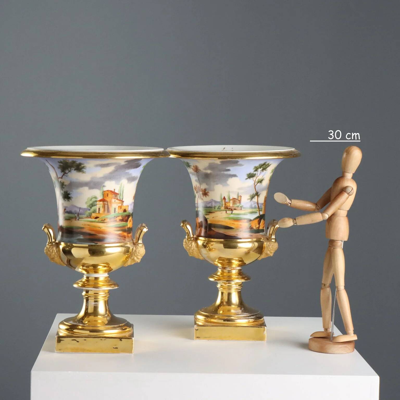 Pair of antique painted and decorated porcelain vases, France, 19th century.