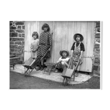 Four children with wheelbarrows