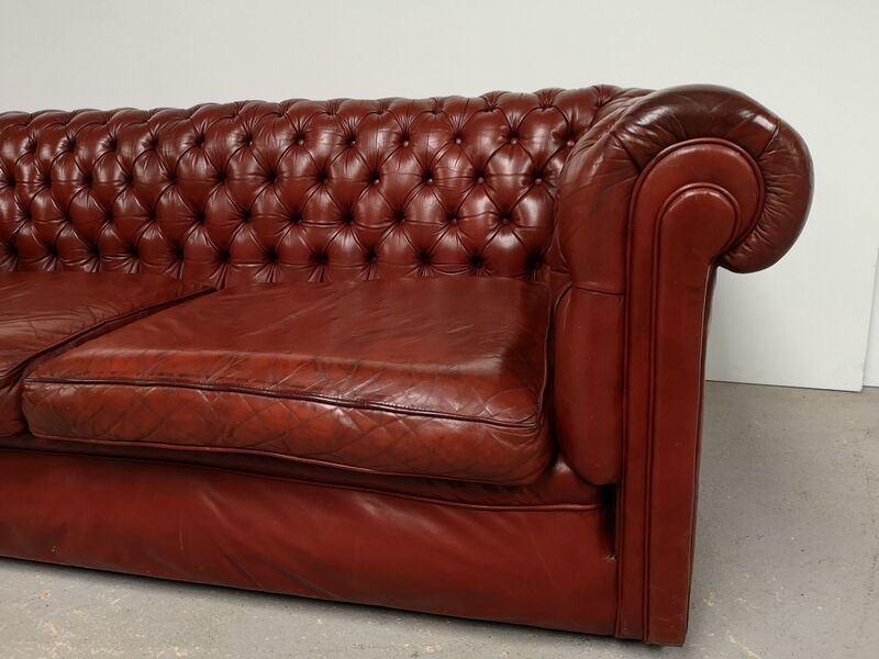 Old red leather Chesterfield sofa