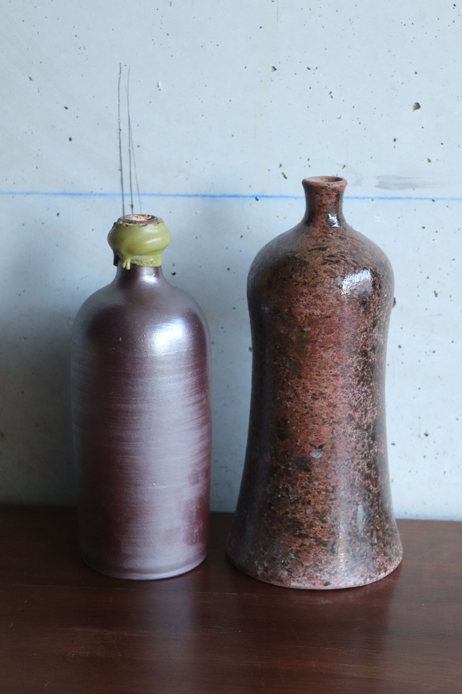 2 vintage ceramic bottles