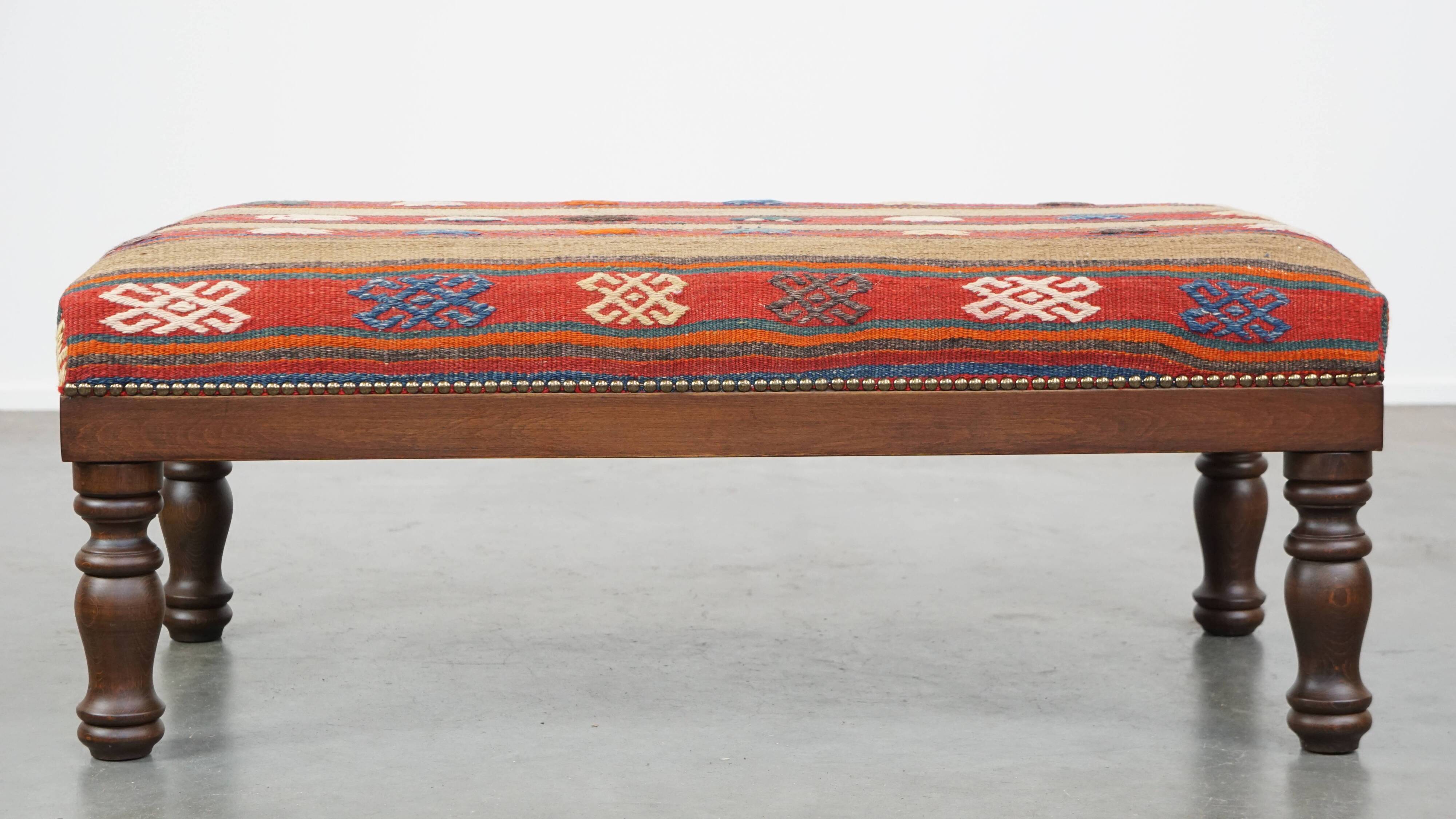 Oriental pouf upholstered in an antique kilim