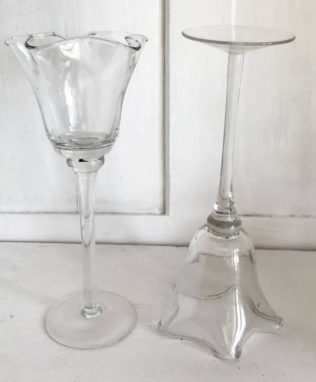 Pair of glass candlesticks on a stand