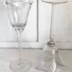 Pair of glass candlesticks on a stand