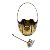 silver metal sugar bowl with gold patina