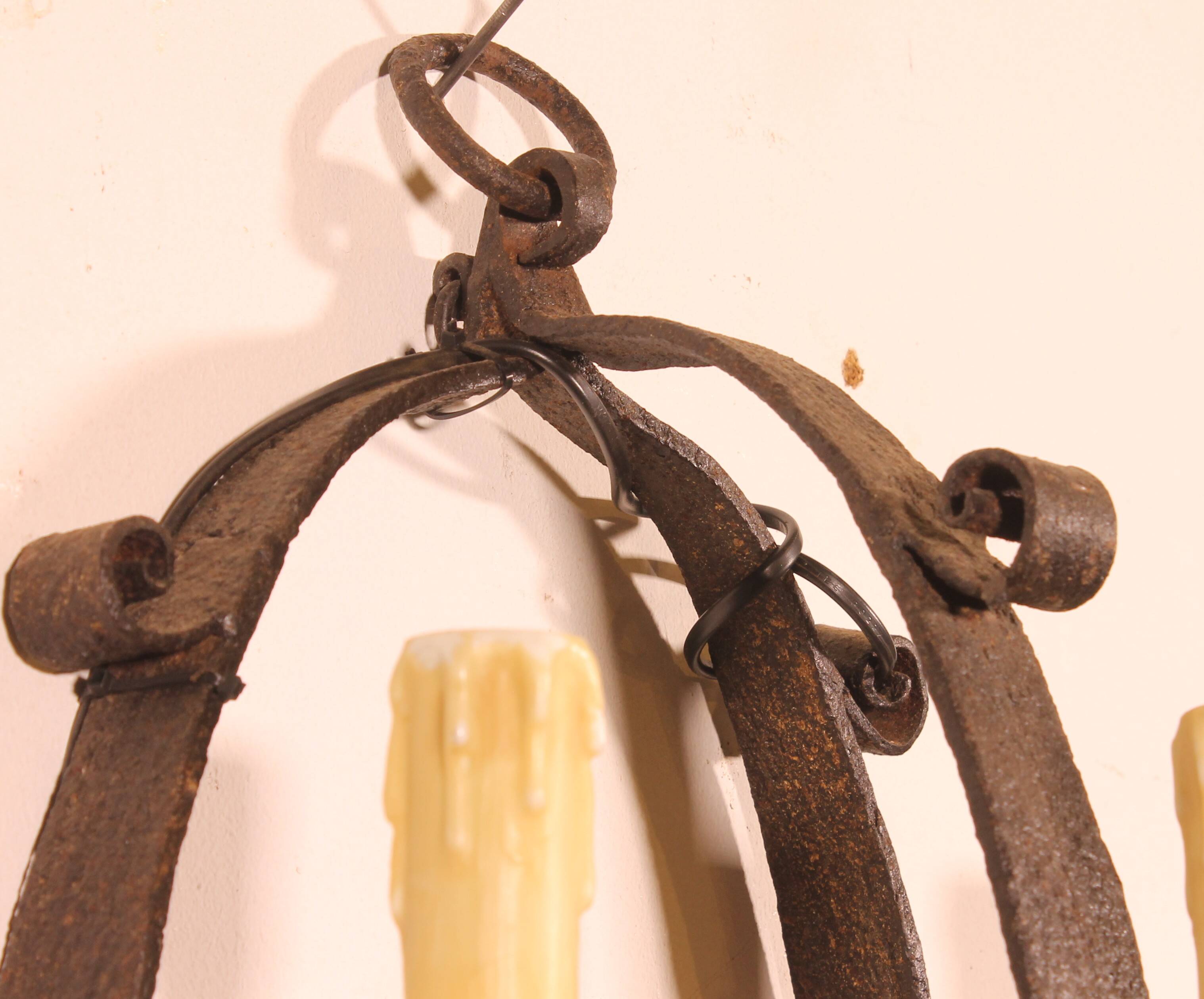 Pair of wrought iron wall sconces in medieval style