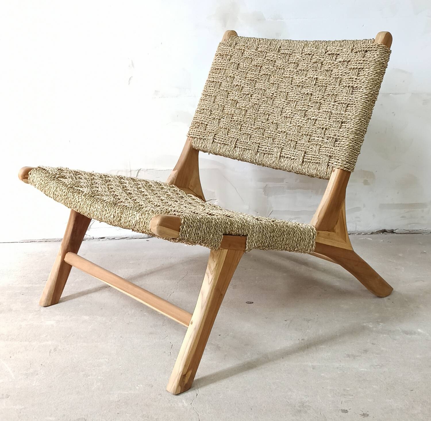 Pair of low armchairs in wood and woven rattan