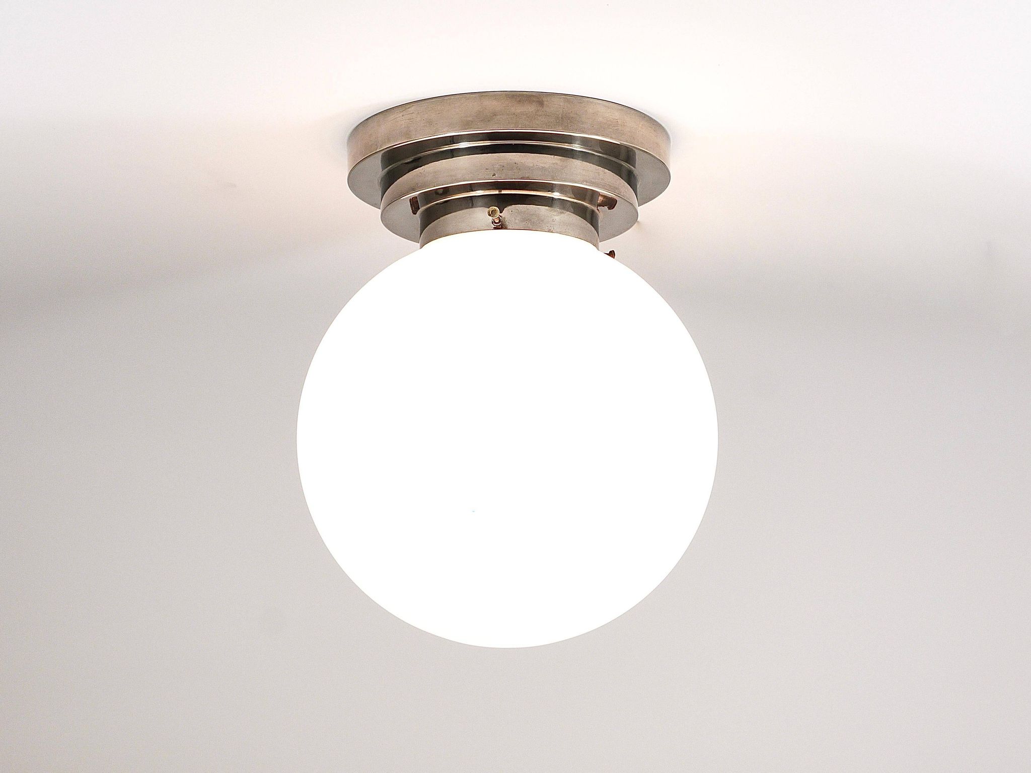 Large opaline glass globe ceiling lamp in Art Deco style.