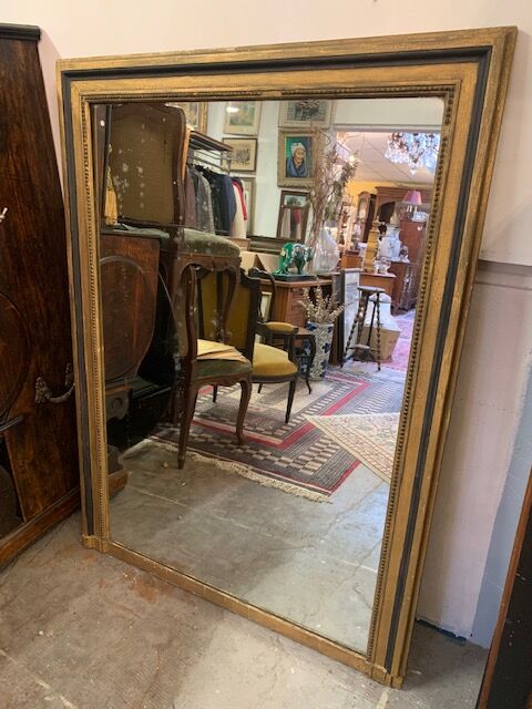 Giled and black fireplace mirror