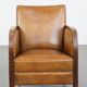 Cognac-colored sheepskin and wooden Art Deco design armchair