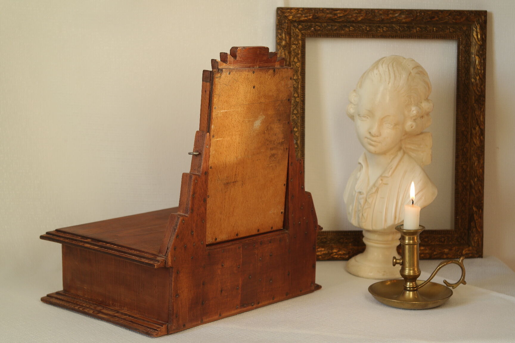 Antique wooden table mirror in Art Deco style.