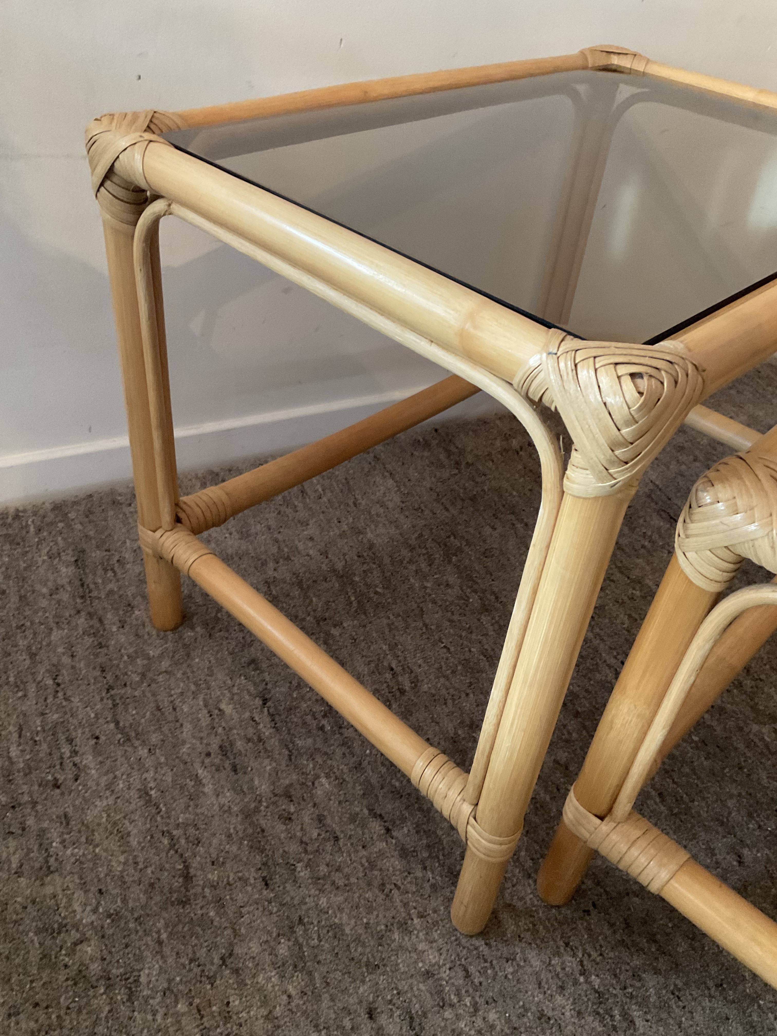 Trio of vintage pull-out tables in rattan and smoked glass 70s