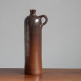 Enamelled brown sandstone bottle with handle