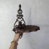 Old cast iron planter shell-shaped plant support