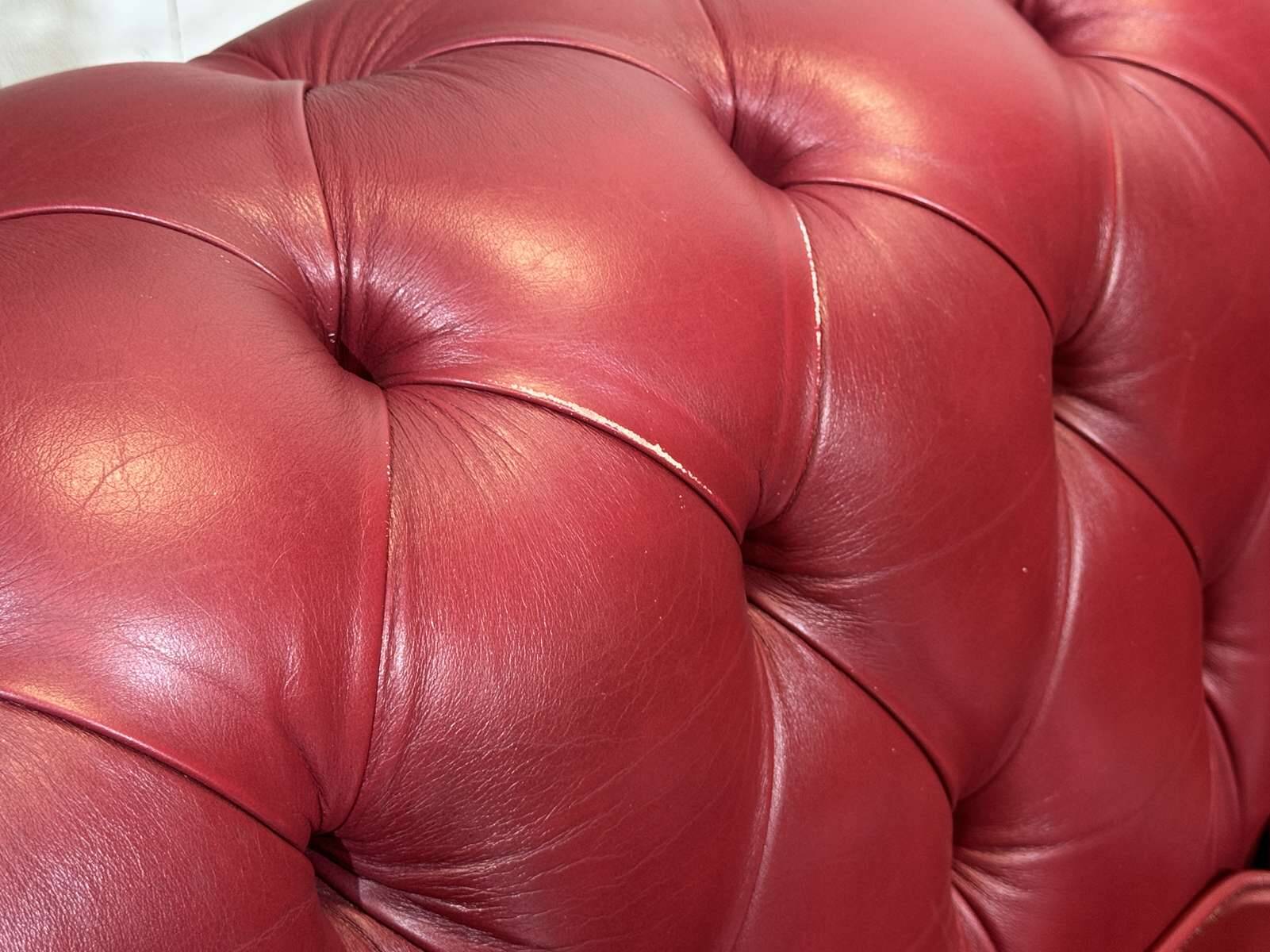 Chesterfield 2-seater leather sofa, modern production from the 2000s.