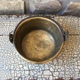 Basin cauldron or old garden in yellow copper