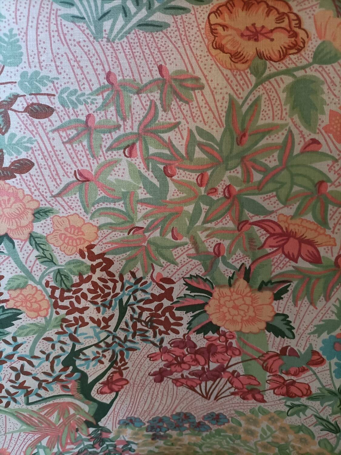 pair of toad armchairs in floral fabric.