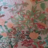 pair of toad armchairs in floral fabric.