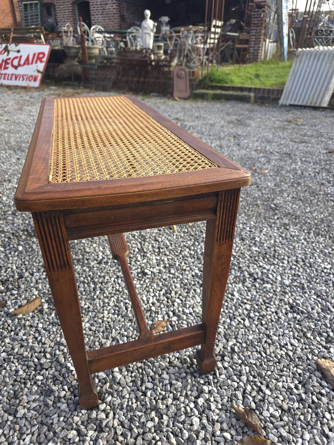 Beechwood piano bench with caning on the seat