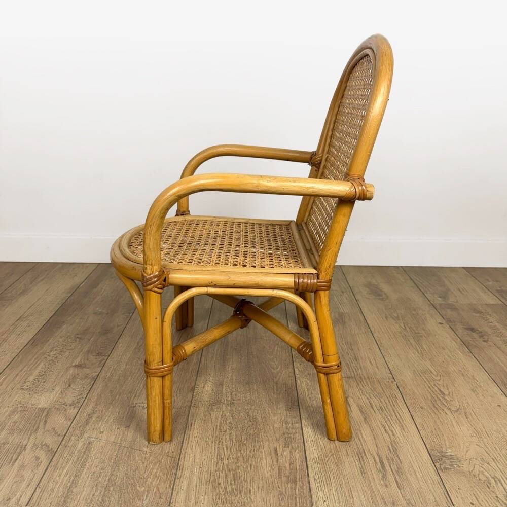 Child's armchair in rattan and caning from the 1960s.