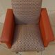 Retro vintage rockabilly armchair in orange faux leather and vintage fabrics
