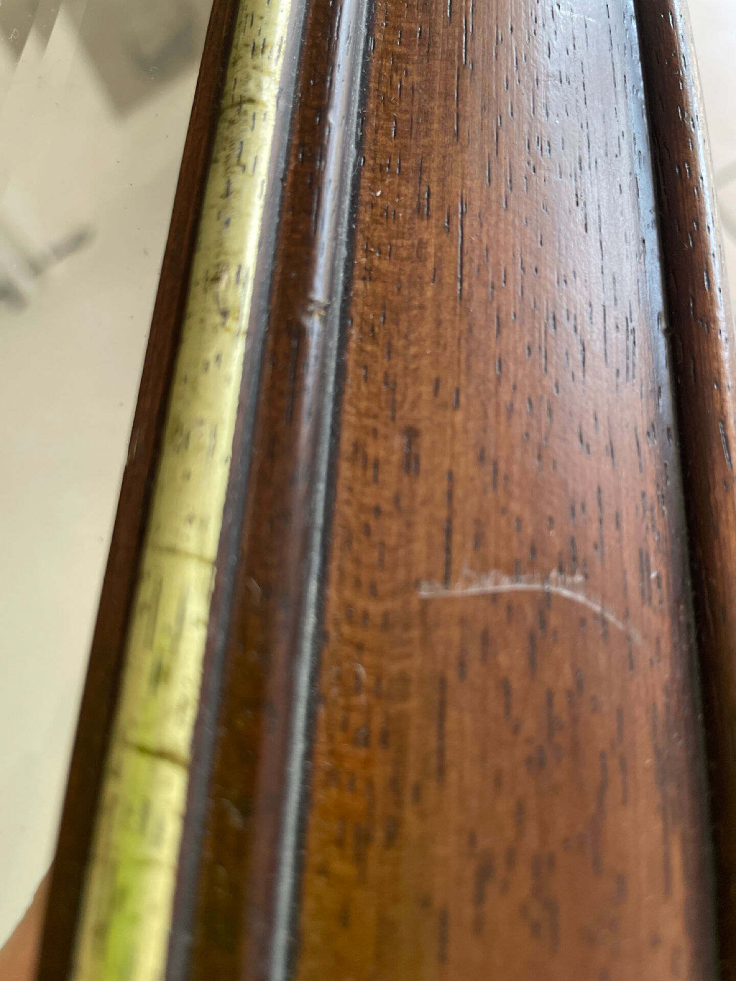 Vintage bevelled wall mirror in stained wood and brass