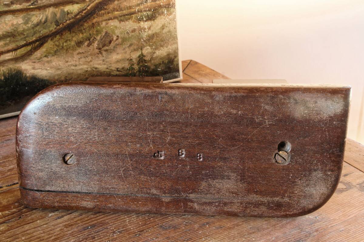 Pair of Art Deco carved wood candlesticks, signed Delaporte