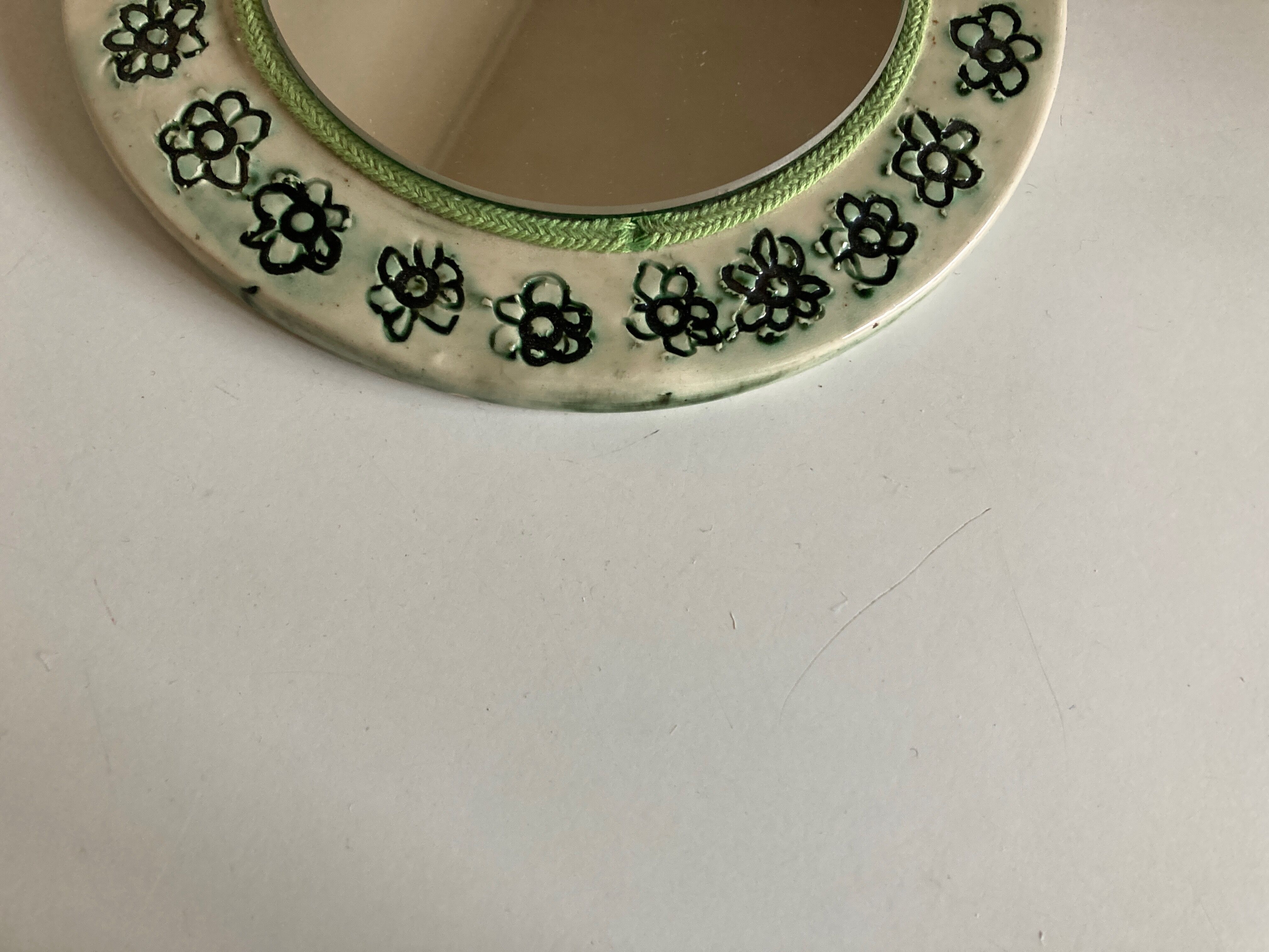 Incised ceramic mirror with flowers 1960