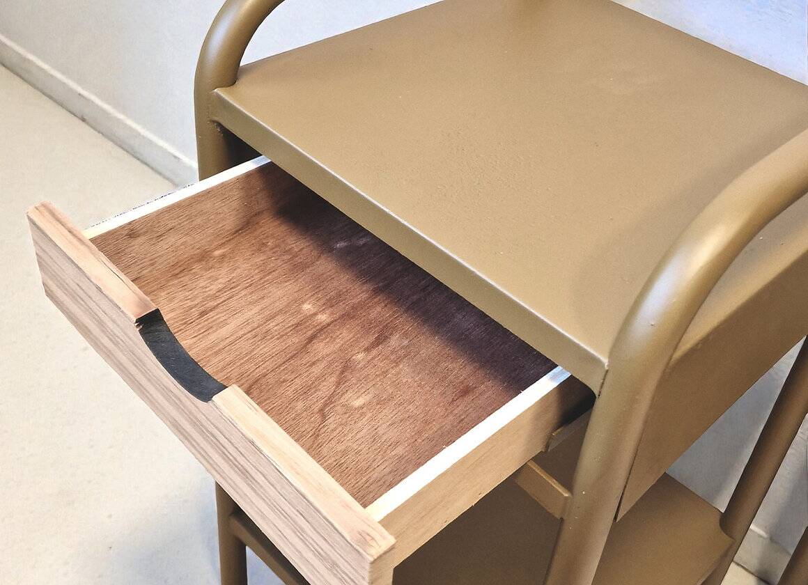 Old ochre metal bedside tables from a boarding school.