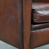 Armchair made of sheepskin leather in art deco design with warm colours