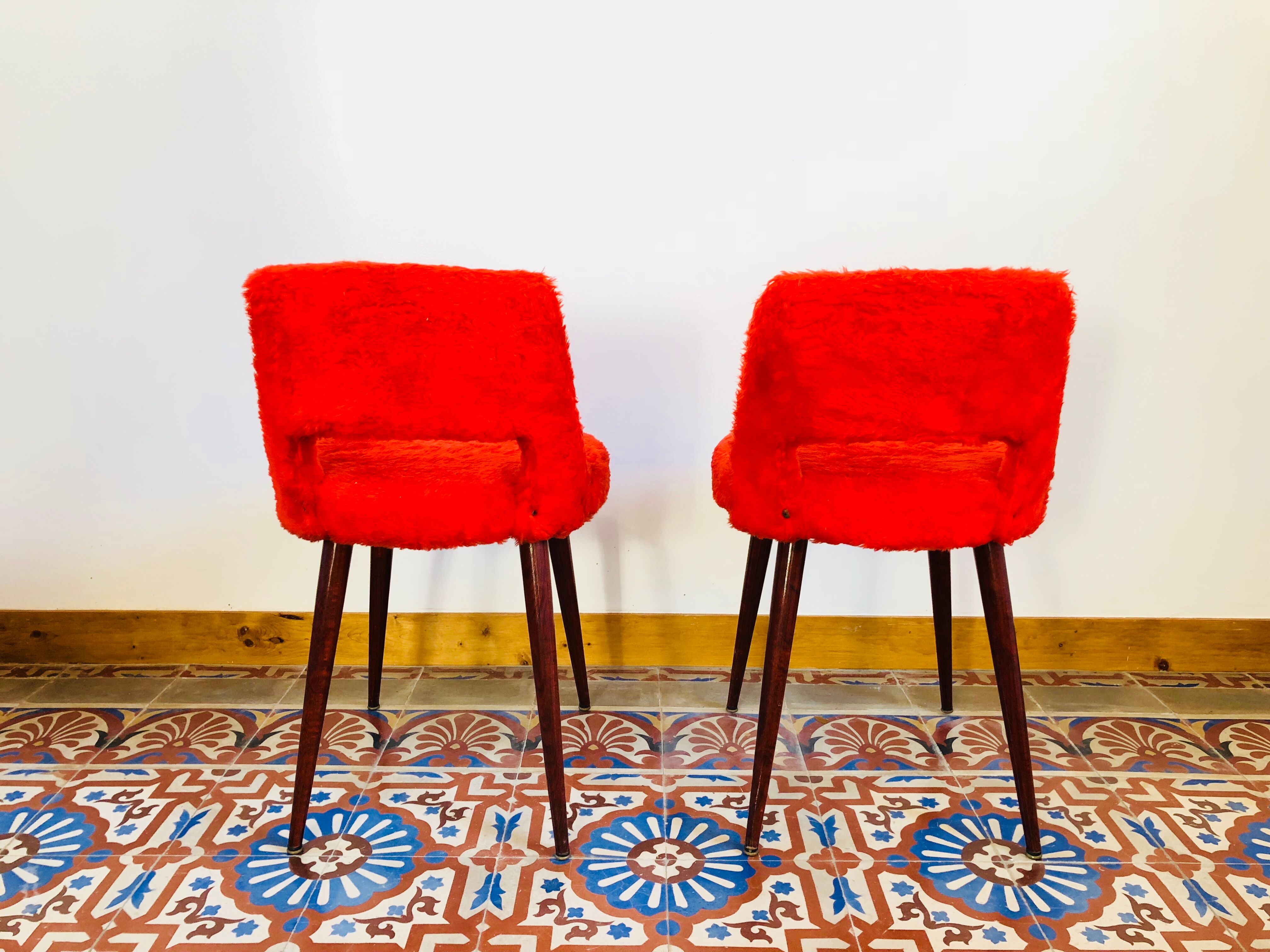 Pair of chairs red rug