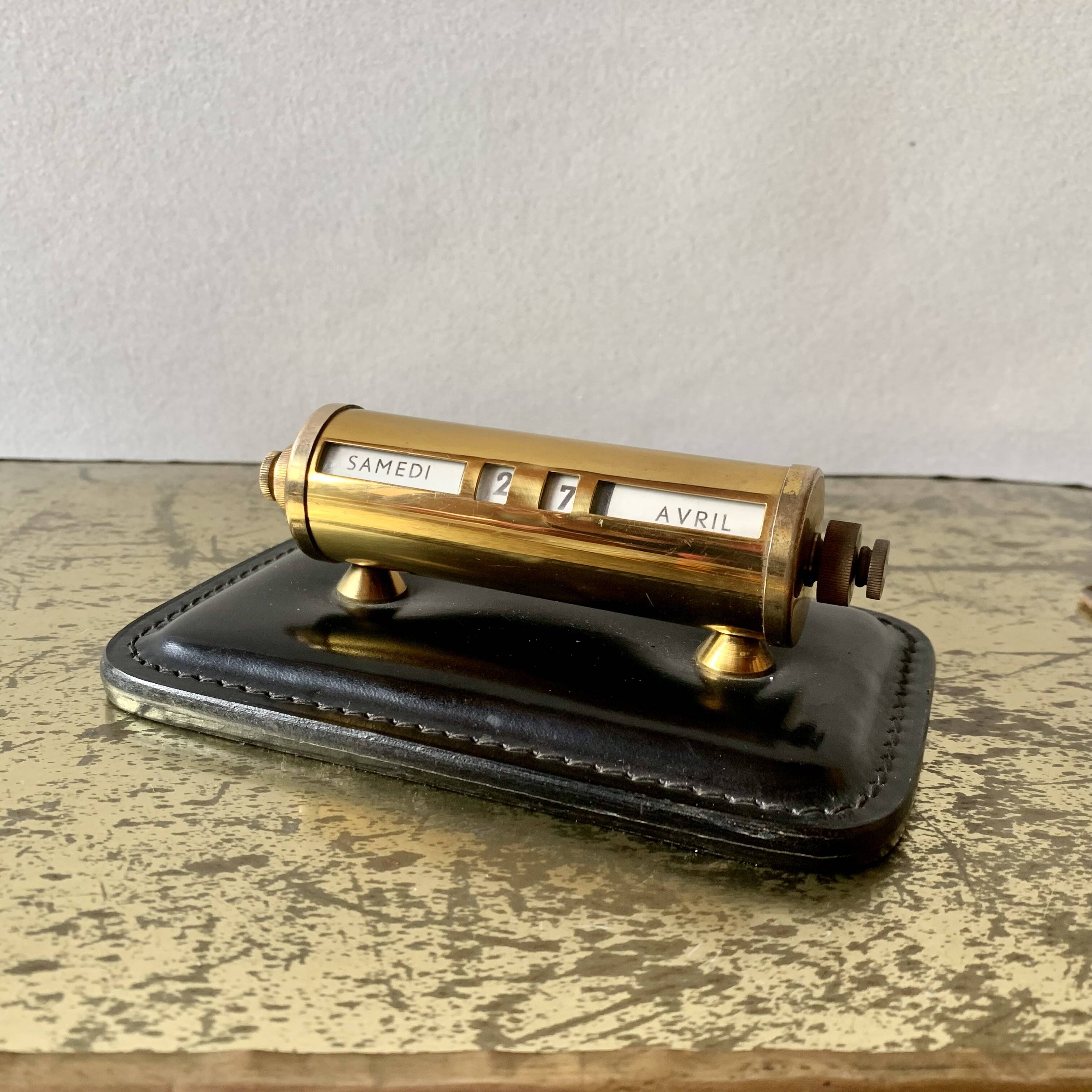 Old perpetual calendar in leather and brass
