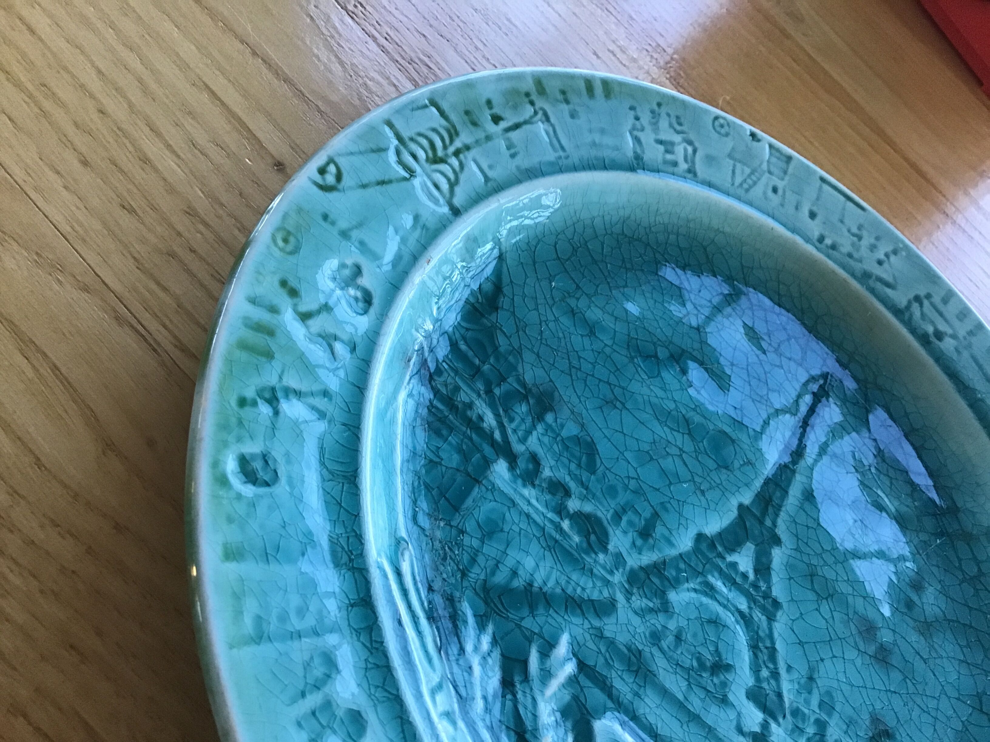 Cracked earthenware plate the Eiffel Tower